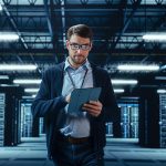 Photo of man inside a secure colocation data center