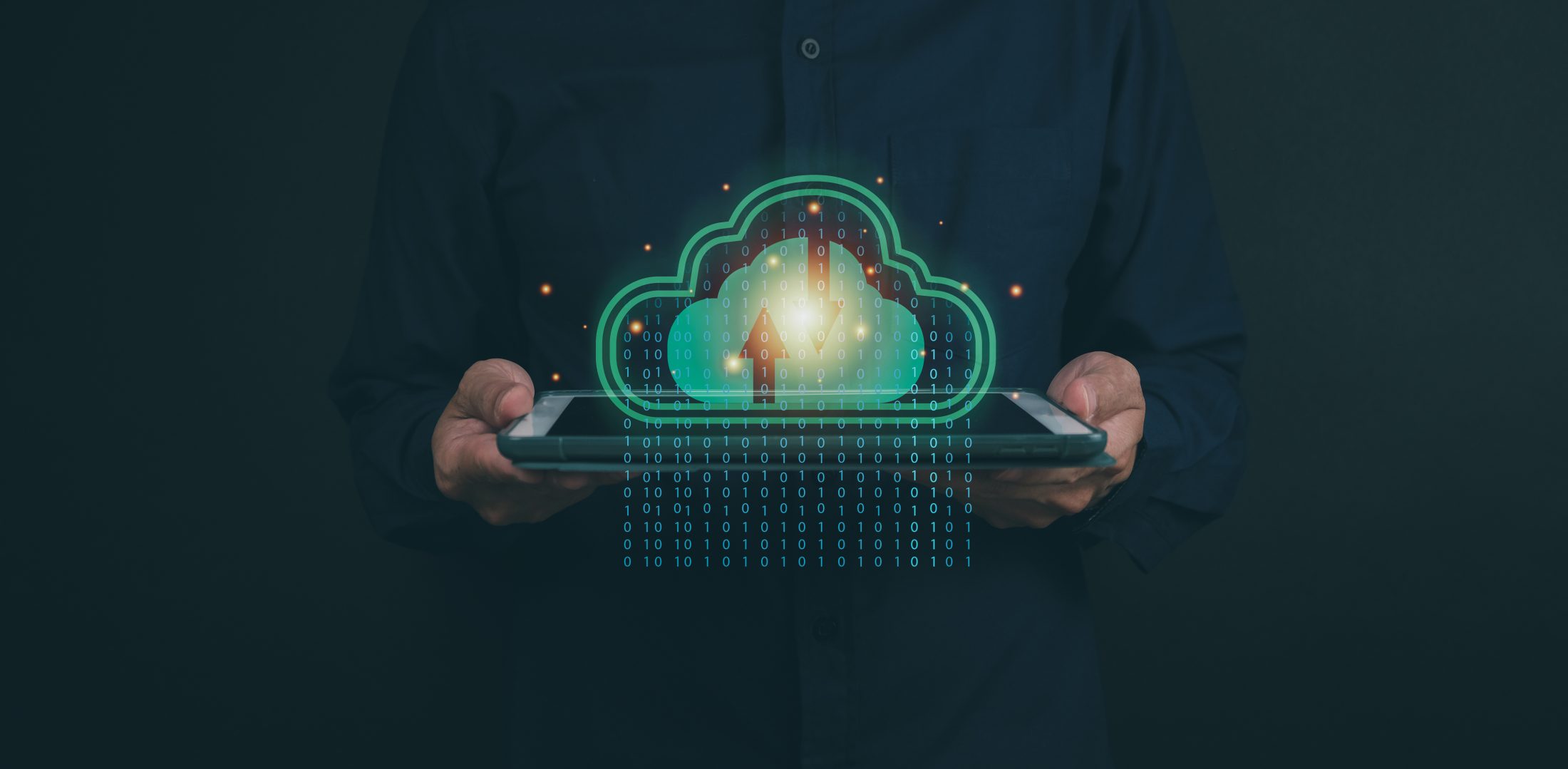 An Opus Interactive blog post image depicting a man holding a tablet; there is a graphic of a green cloud-backup icon and binary broadcasting from the tablet screen.